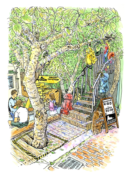 キャットストリートの一角、木に隠れる様な階段を上る、バックパック専門店グレゴリー。黄色いサインボードにはグレゴリーUSA本社まで8000ｋｍと。